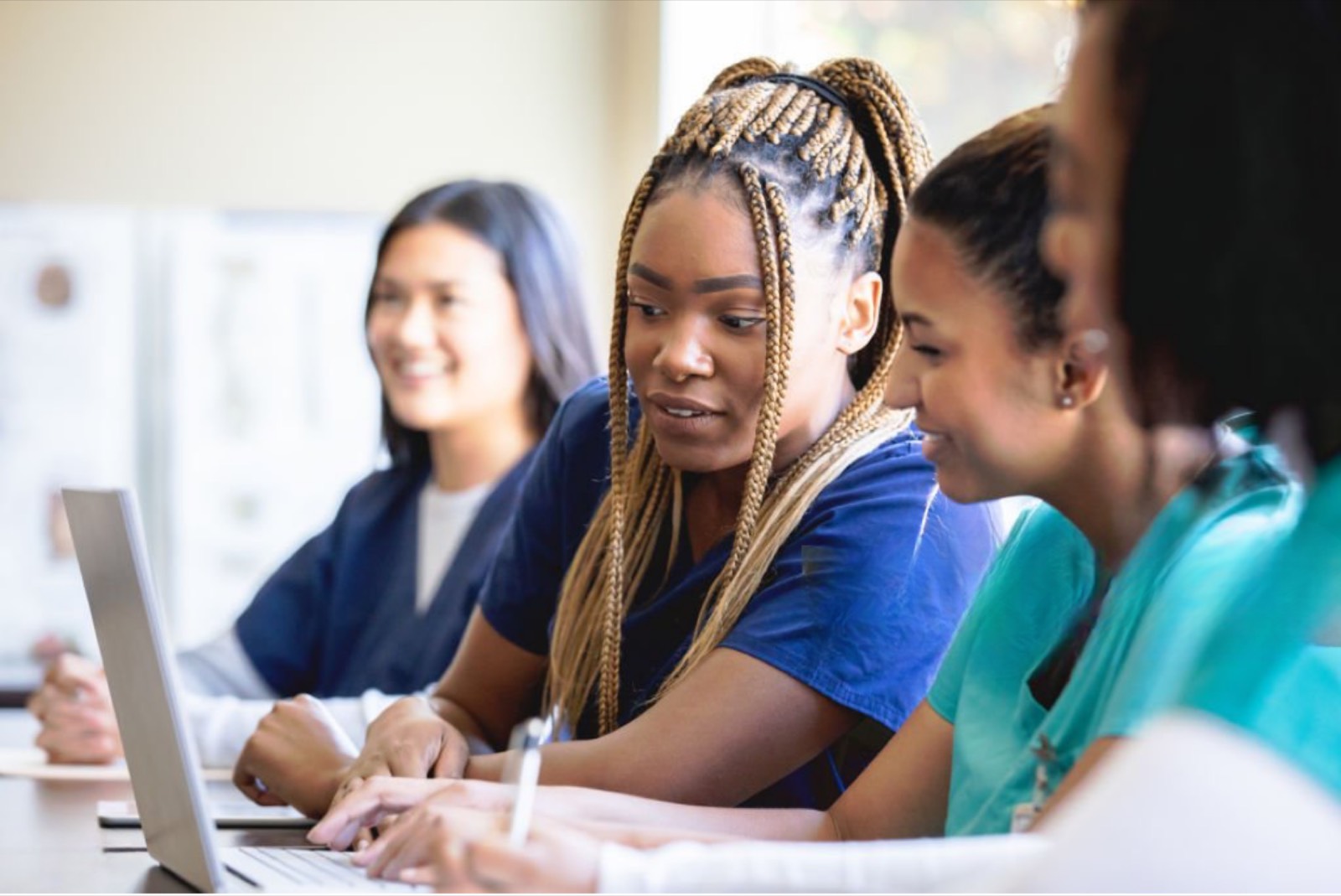 Caregivers studying together at Flobega Academy